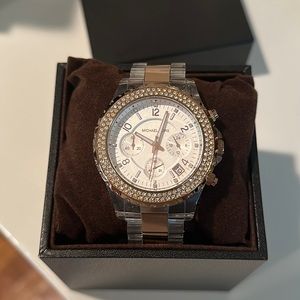 Michael Kor’s clear and rose gold crystal dial Watch